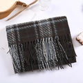 Detailed view of winter plaid scarf with fringe tassels and soft knitted texture - Coffee and Blue Stripes