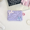 Flat lay of a light purple quilted cosmetic bag with decorative bows and zipper detail - Light Purple Plaid