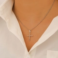 Close-up of minimalist silver cross pendant necklace on model with refined chain detail - Hollow Cross Necklace (G-295) / Steel