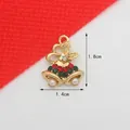 Detailed view of Christmas bell pendant with red green rhinestones and faux pearls 1.8x1.4cm - Christmas Bell