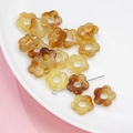 DIY amber gradient acrylic flower charms for jewelry making displayed in a white bowl - 14mm / 14# Transparent Dyeing (kp6522)