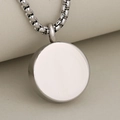 Polished silver stainless steel round paw print cremation urn necklace for pet memorial - Steel