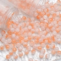 Macro detail of 10mm orange and white ice-cracked glass beads for DIY jewelry making - 10mm / Orange & White