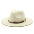 Detail of hand-woven straw Panama hat with a black band and decorative gold chain accent - Adjustable / Milk White