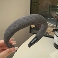 Thick charcoal grey sponge headband featuring a handmade woven label and knitted texture - Grey With Label