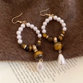 Detail of vintage tiger eye and pearl hook earrings with golden metal spacers - Ear Hook - White - Coffee