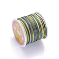 Detailed close-up of rainbow gradient nylon cord roll for DIY jewelry weaving - Color No. 23