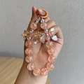 Peach acrylic beaded phone strap with iridescent bow charms and ice-crackle beads - Peach Bow