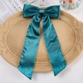 Teal satin oversized bow hair clip with long ribbons on an elegant beige tray - Duckbill Hair Clips / Teal