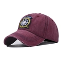 Close-up of distressed brim and Marine embroidery on washed cotton baseball cap - Adjustable / Marine Wine Red