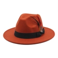 Detail of orange wool felt fedora featuring a black ribbon and decorative feather accessory - M (56-58cm) / Caramel color