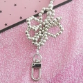 Silver beaded flower keychain with metal lobster clasp on a sparkling pink background - 110cm / Silver