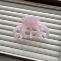 Close-up of pink translucent resin claw clip with cloud texture on grey display box - Pink 3+4 Claw 10cm