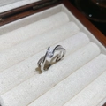 Macro detail of a silver crossover ring with white zircon stones and an open adjustable band - 52# Ring-Silver