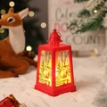Detail of red Christmas lantern featuring Santa patterns and warm LED lights for holiday decor - Red Santa Claus