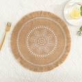 Macro detail of round jute placemat with white mandala pattern and fringe edges - Natural Jute Tassel White Pattern 2