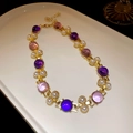 Detail of vintage gold necklace featuring purple and pink gemstones with white pearl accents - 24# Necklace - Gold - Pink/Purple Gemstone Pearl
