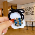 Élastique à cheveux avec fleur dorée ornée de strass bleus et transparents - Bleu