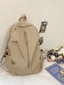 Minimalist large capacity beige backpack with vertical zipper and woven puller on texture rug - Khaki