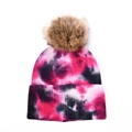 Detail of tie-dye knit beanie with fluffy faux fur pompom and ribbed cuff - Tie-dye Rose Red