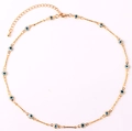 Macro detail of gold-plated chain with blue evil eye charms and adjustable lobster clasp - Light Blue Necklace
