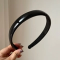 Classic vintage black faux leather headband with a sleek glossy finish for women - Black