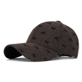 Deep charcoal tweed baseball cap with black embroidered bow pattern for autumn fashion - Brown