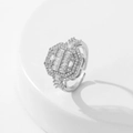 Macro shot of silver adjustable ring featuring rectangular and round zircon inlay details - Style 7 / Silver