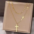 Elegant 18K gold-plated double-layer necklace with three delicate cross pendants - Gold