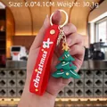 Green silicone Christmas tree keychain with red strap and yellow star detail - Christmas Tree with Colorful Stones