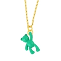 Detail of a minimalist gold necklace featuring a vibrant green teddy bear pendant - Emerald Green