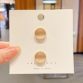 Champagne gold round cat eye pin brooch set for necklines on a jewelry display card - Style 6 - Cat's Eye 2-Piece Set