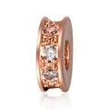 Macro shot of rose gold plated spacer bead with triple row of inlaid clear zircon stones - Rose Gold/White Zirconia
