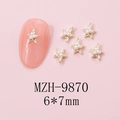 Macro view of MZH-9870 gold starfish nail charms with white pearls and 6x7mm sizing - MZH-9870 (6*7mm)
