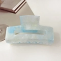 Detail of square hair claw clip with blue and white marble texture and gold glitter - 10.5cm Rectangular / Starry Blue