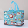 Blue non-woven Christmas gift bag with Santa and snowman prints for festive shopping - Christmas 13