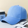 Sky blue cotton baseball cap with structured panels and curved brim on a book - Lake Blue (6-Panel Synthetic)