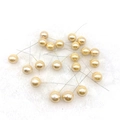 Macro view of champagne gold artificial pearl berry stems for Christmas DIY decoration - 15mm / Ginger Yellow
