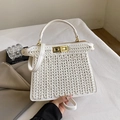 Elegant white woven leather handbag with a gold twist lock and a sleek top handle - White