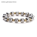 Detail view of 10mm silver knurled and gold smooth beads on elastic bracelet - 10mm Bead Diameter / Gold + Silver