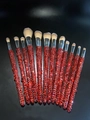 Detail of 12 luxury makeup brushes with glittering red rhinestones on black background - 12pcs Set / Silver Red Mixed Rhinestones