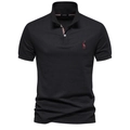 Close-up of deer embroidery and pique fabric on a black cotton polo shirt for men - Black