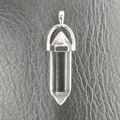 Transparent hexagonal quartz crystal point pendant with a silver metal clasp - Synthetic White Glass