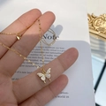 Golden butterfly pendant necklace with pavé cubic zirconia on a delicate link chain - Double Butterfly Necklace [Gold]