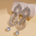 Detailed view of layered hollow silver-tone oval drop earrings with sparkling zircon - Earring Hooks - Silver