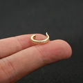 Detailed close-up of a golden U-shaped ear cuff with sparkling zircon stone pavé setting - 2# / Gold
