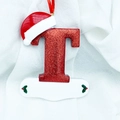 Christmas alphabet letter T ornament with red glitter, Santa hat and white name tag - Letter T