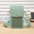 Mini green two-tone crossbody phone bag with leaf clasp and geometric chevron strap - Green