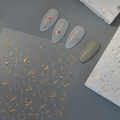 Autocollants à ongles dorés galaxie avec étoiles et lune sur fond texturé gris - Style Étoile Lune Or(CO-477)