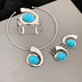Detail of silver-plated resin jewelry set with blue turquoise-style oval stones - Silver Blue Set